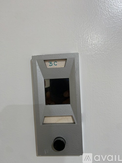 A grey electrical outlet with a 5C label on it.