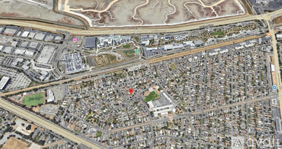A satellite image of a city with a large building in the center.