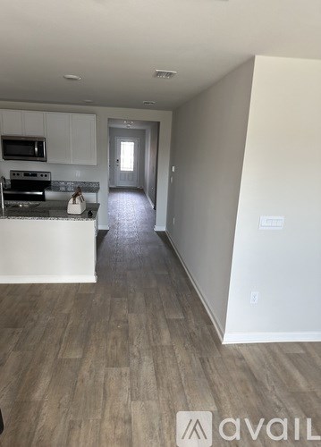 A kitchen with a stove top oven and microwave.