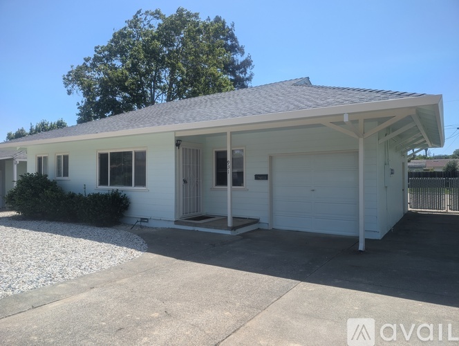 A two-story house with a garage is available for rent.