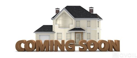 A house with the words "COMING SOON" in front of it.