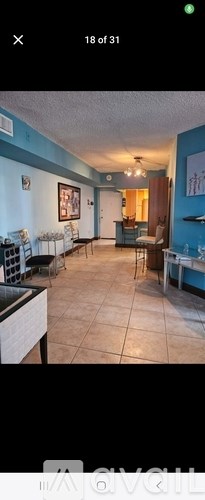 A room with a blue wall and a white ceiling.