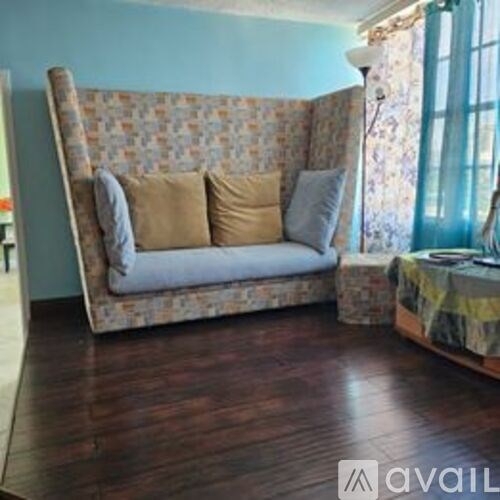 A pool area with a view of the ocean.