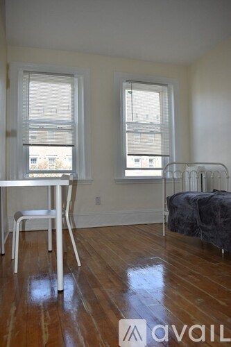 A room with a table and chairs in it.