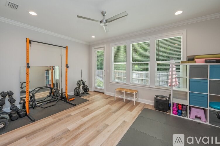 A well-equipped home gym with a variety of exercise equipment.