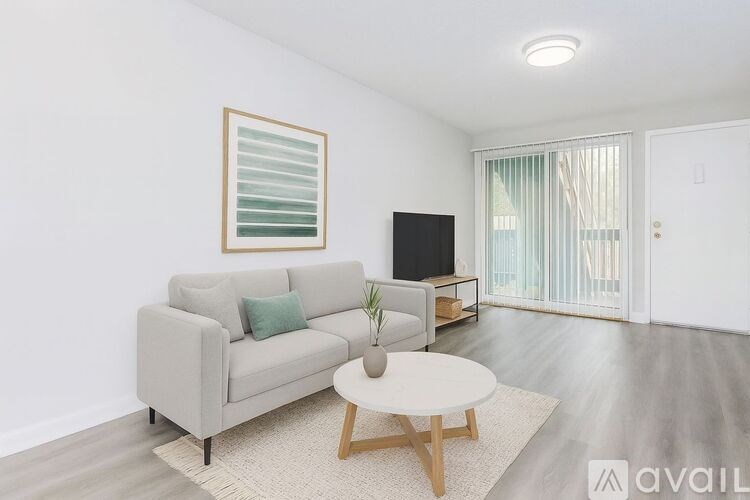 A kitchen with a stove, microwave, and dishwasher.