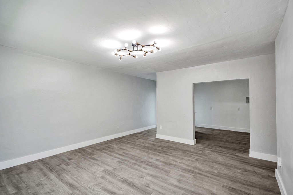 A room with a light grey floor and white walls.