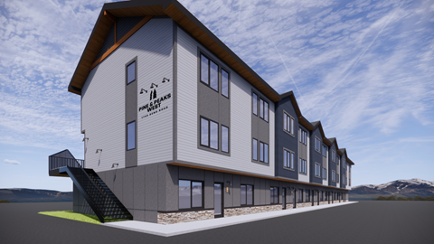 A rendering of a modern building with the words "Pine Crest" on the side.