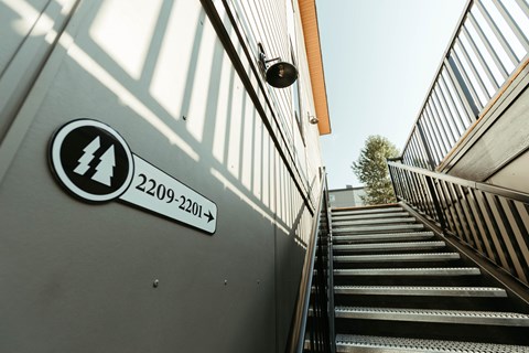 A staircase with a sign that says 2209-2201 on it.