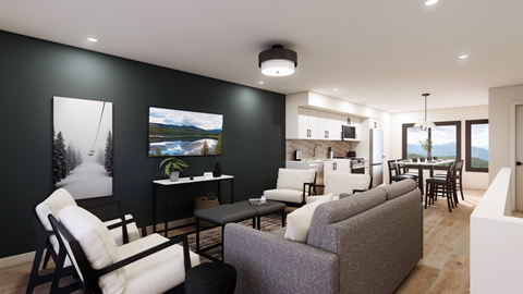 A living room with a grey couch and a black and white chair.