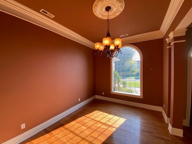 A room with a chandelier and a window.