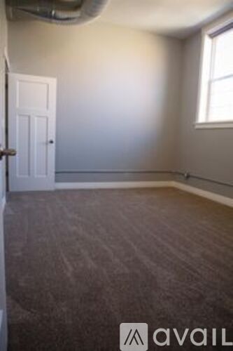 A room with a door and a window.
