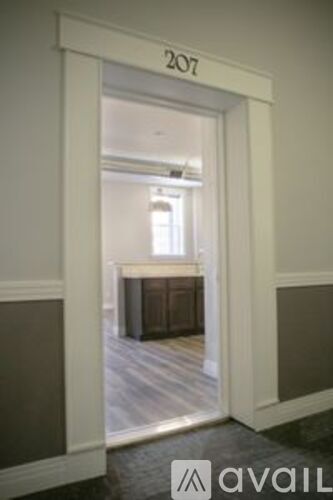 A doorway with the number 207 on the top.
