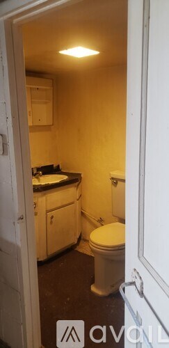 A small bathroom with a toilet and sink.