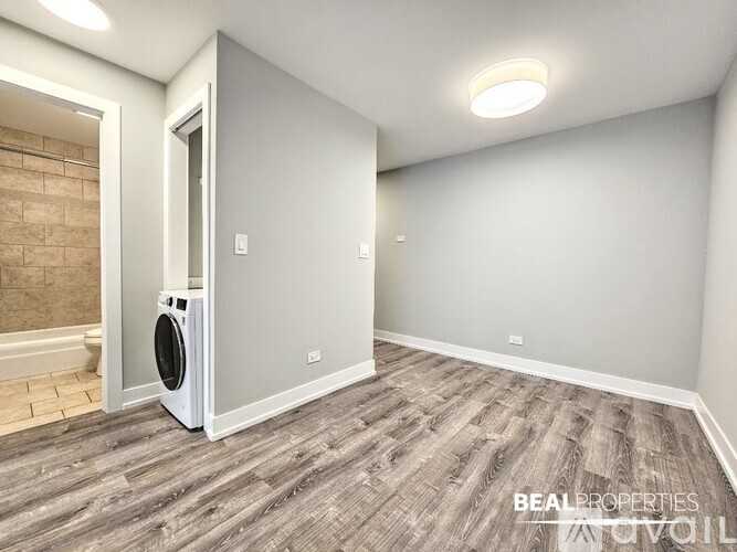 A room with a washing machine in it.
