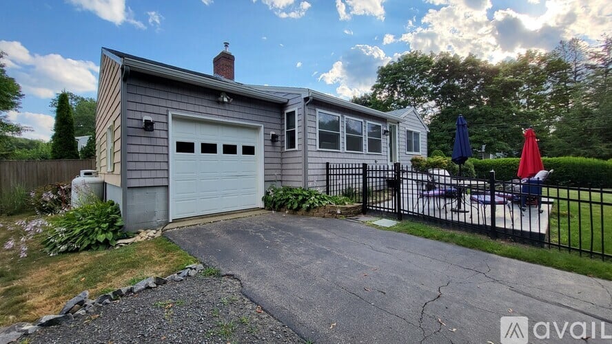 A house with a garage is available for rent.