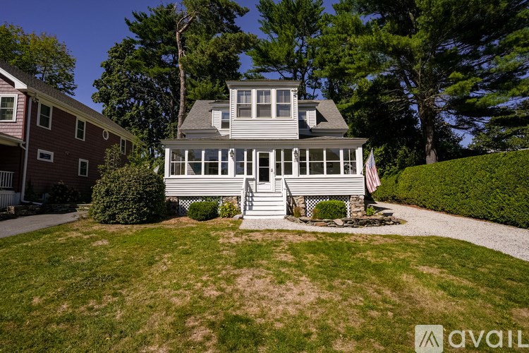 A house with a flag on the front porch.