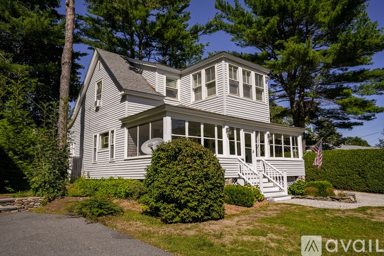 A house with a flag on the front porch.