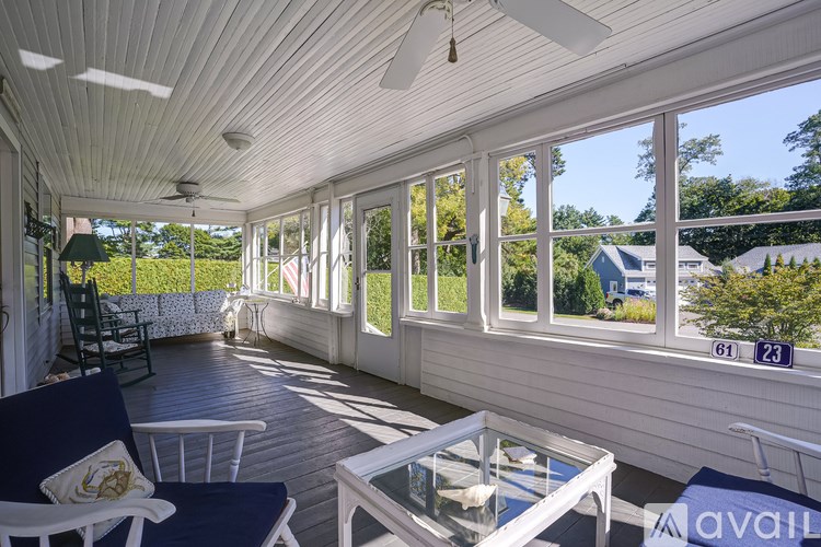A sunny day on the patio with a table and chairs.