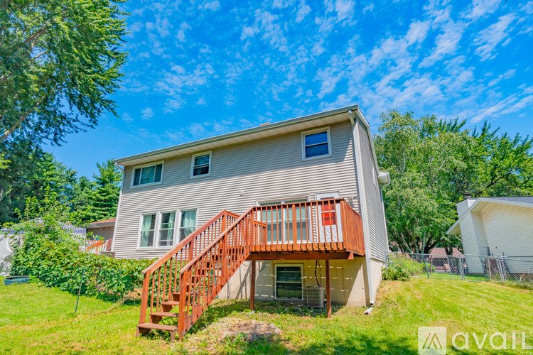 A house with a red staircase is for sale.