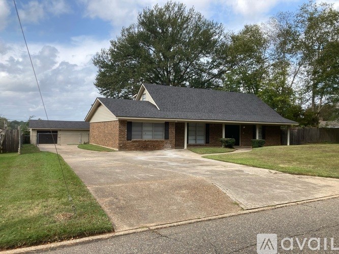A house with a driveway in front of it.