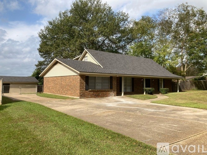 A house with a driveway in front of it.