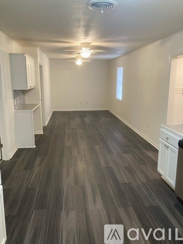 A room with a washer and dryer in it.