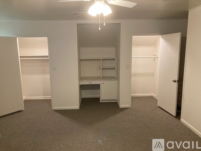 A room with a desk and a printer in it.