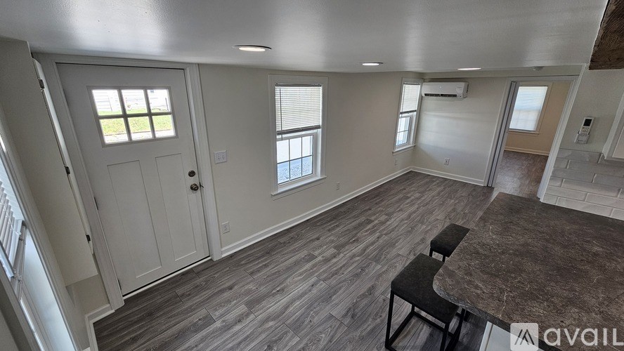 A room with a table and chairs in it.