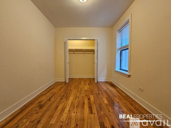A room with wooden floors and a white door.