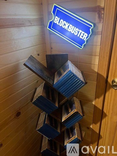 A stack of DVDs in front of a Blockbuster logo.