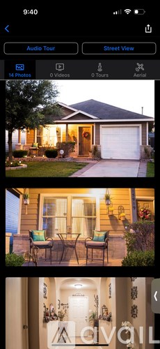 A house with a front porch and a garage door.