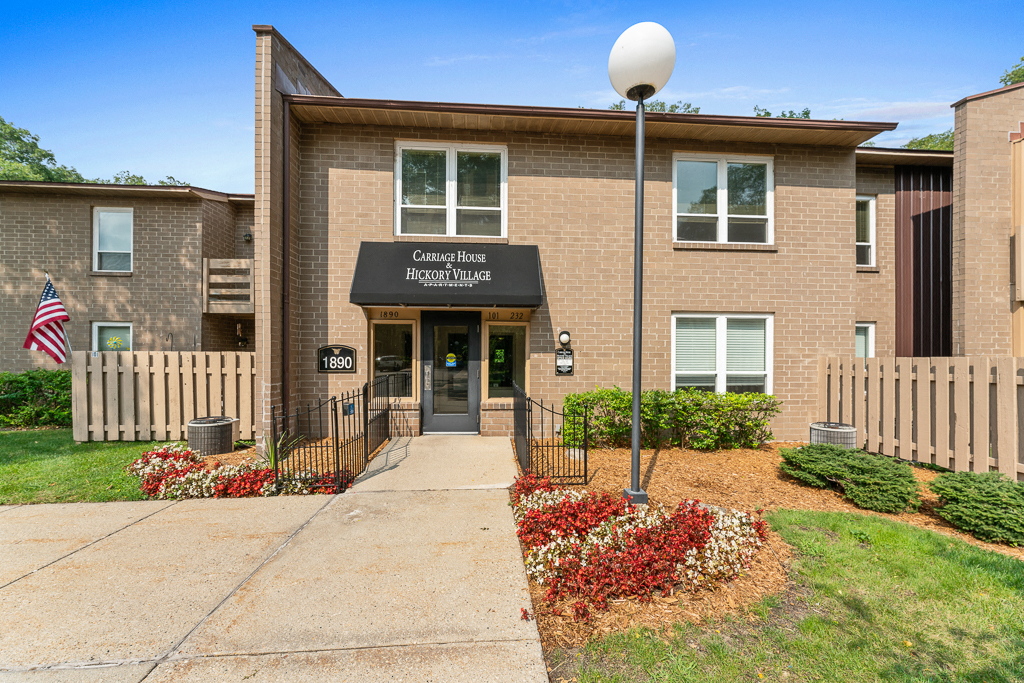 The image shows a building with a sign that reads "Covenant House Inc. Hygge House."