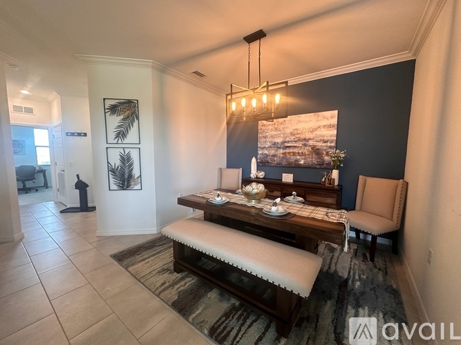 A living room with a wooden bench and a painting on the wall.
