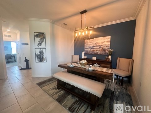 A living room with a wooden bench and a painting on the wall.