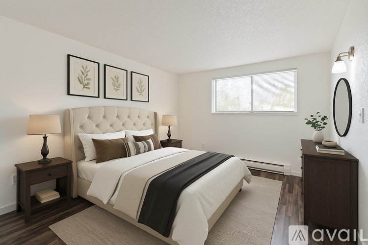 A bedroom with a large bed, a nightstand, and a window.