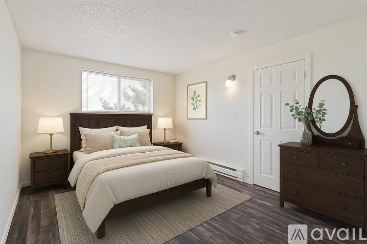 A bedroom with a large bed, two nightstands, and a mirror.