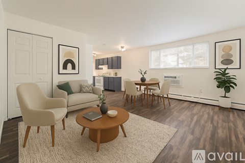 A living room with a brown coffee table and a white couch.