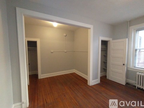 A kitchen with a stove, sink, and refrigerator.