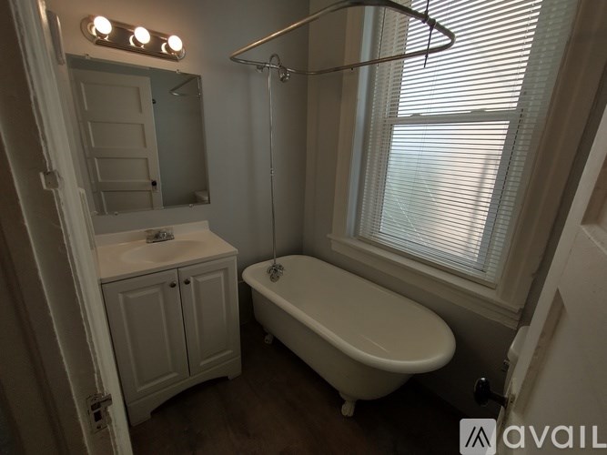 A kitchen with white appliances and cabinets.
