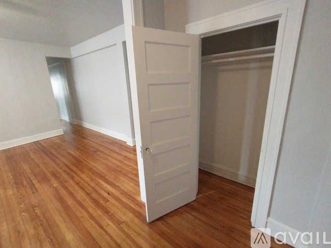 A bathroom with a tub and toilet.