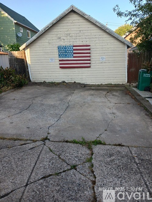 A small building with an American flag on it.