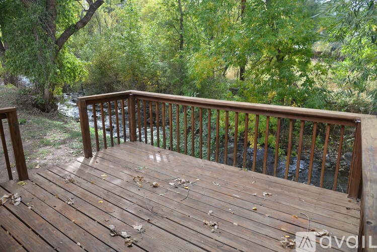A living room with a piano and a couch.