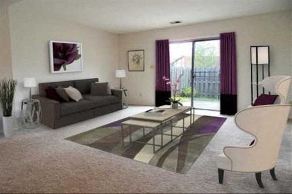 a living room with a couch and a table