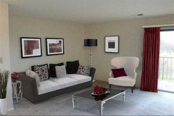 a living room with a couch and a table