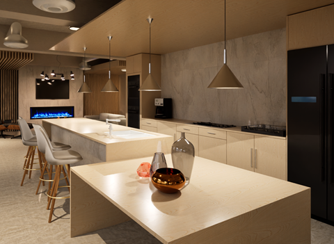 A modern kitchen with a long counter and bar stools.