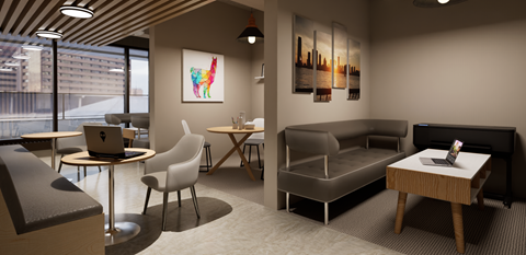 A modern office space with a large window, a desk with a laptop, a chair, a couch, and a small table.