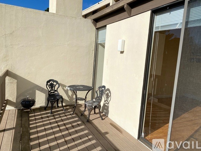 A patio with a table and chairs is shown.