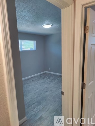 A room with a door and a window.