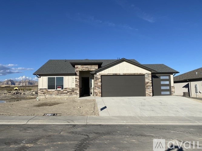 A house with a garage is shown in the image.